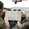 Boulder_senior-people-road-trip-with-map