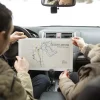 Dakota Ridge_senior-people-road-trip-with-map